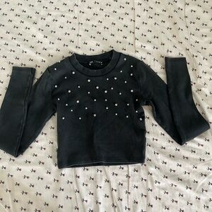 Stylish Black Top with Pearl Accents